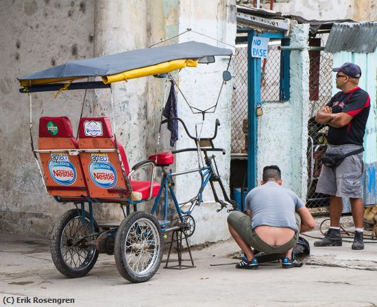 Missing Image: i_0032.jpg - Fixing-the-Taxi-tire-Havana