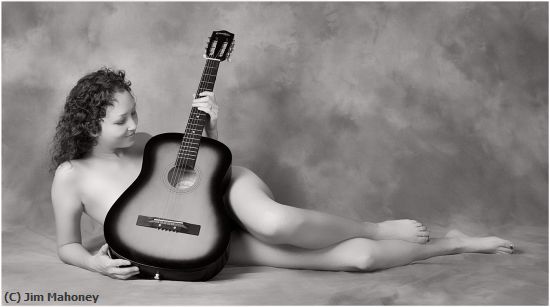 Missing Image: i_0056.jpg - Kelsey Holds a Guitar